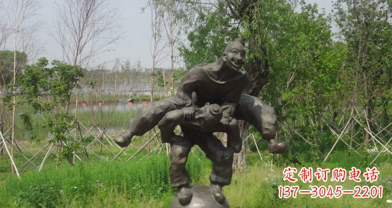南阳园林站在球上面跳山羊的人物景观铜雕